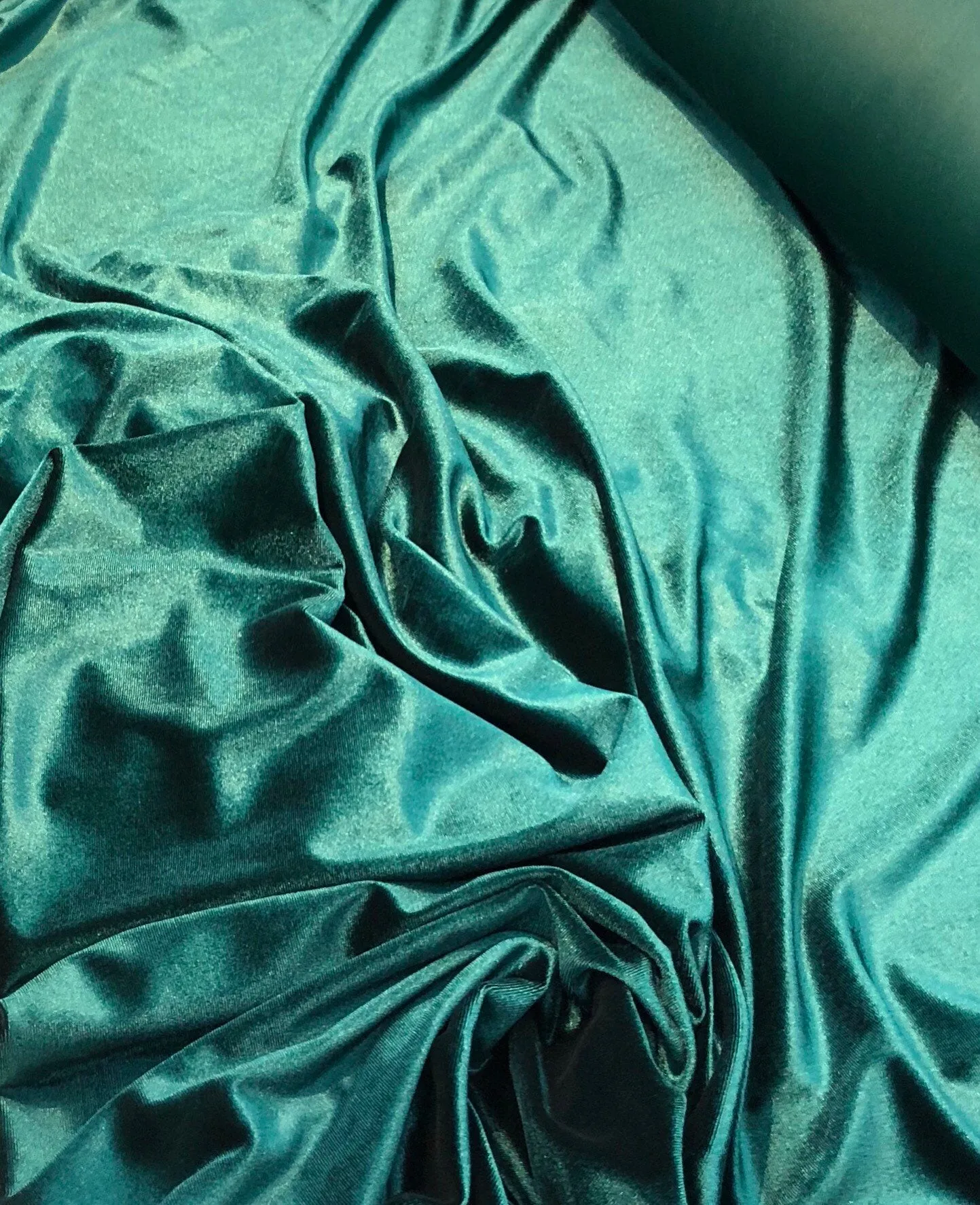 Strech velvet 60&quot; wide      Beautiful bottle green color    Fabric sold by the yard